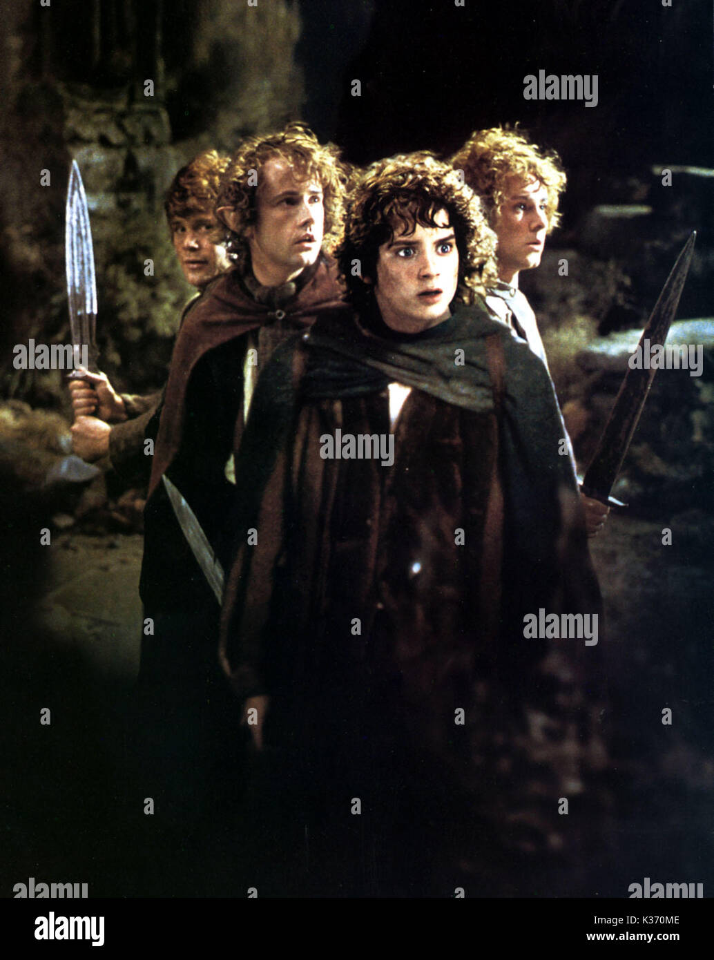 THE LORD OF THE RINGS: THE FELLOWSHIP OF THE RING L-R: SEAN ASTIN as Samwise Gamgees, BILLY BOYD as Pippin, ELIJAH WOOD as Frodo Baggins, DOMINIC MONAGHAN as Merry YOU MUST CREDIT: NEW LINE CINEMA Stock Photo