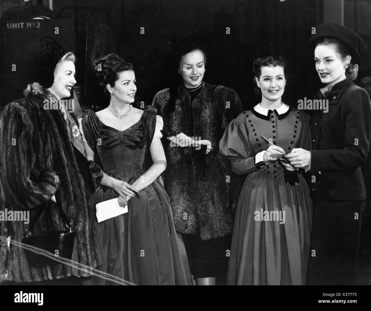 MARGARET LOCKWOOD (SECOND RIGHT) AND PATRICIA ROC (4TH RIGHT) BEING VISITED BY THE GOLDWYN GIRLS AT SHEPHERD'S BUSH STUDIOS IN 1947  PHOTO BY JOHN JAY Stock Photo