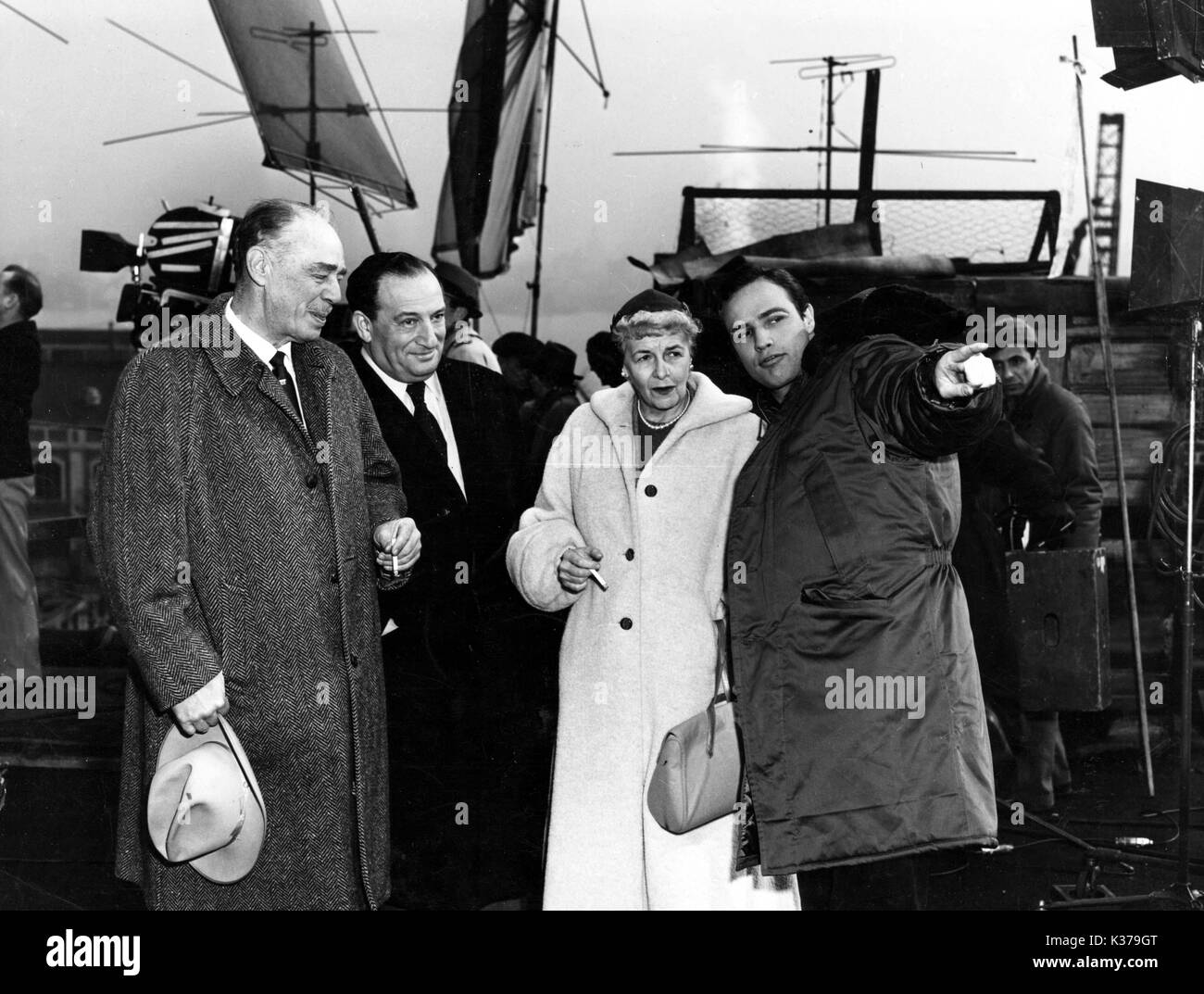 Marlon Brando's father, Sam Spiegel (producer), Brando's mother and Brando on the set of On The Waterfront Stock Photo