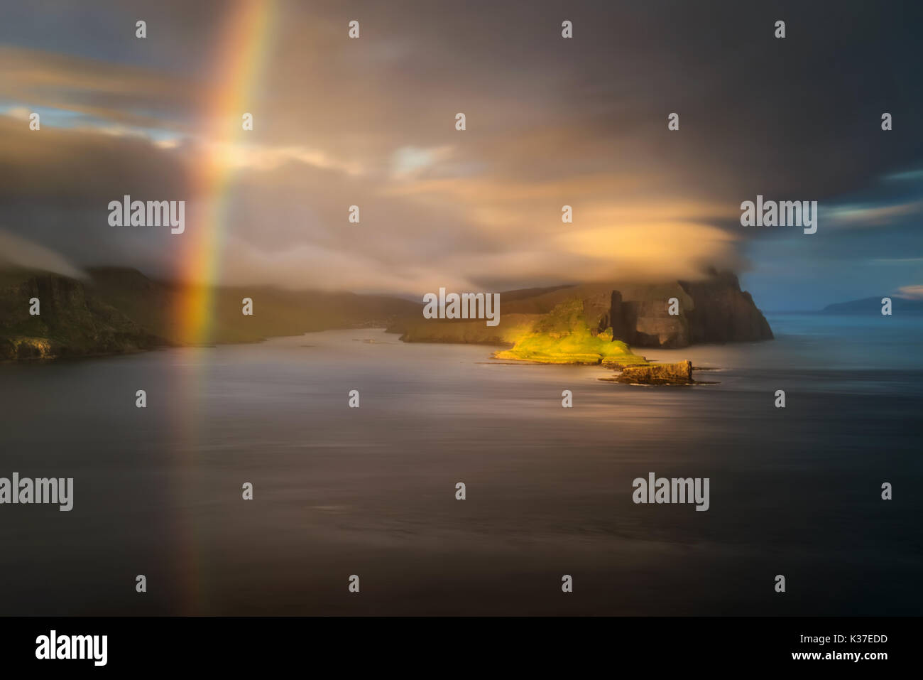 Vagar and Tindholmur islands with rainbow in sunset, Faroe Islands ...