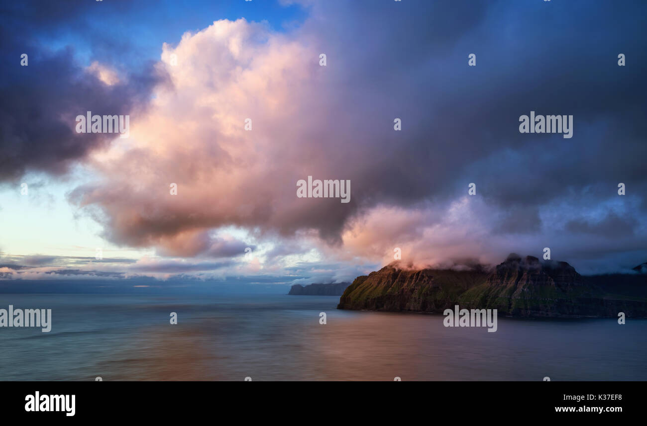 Vagar island in clouds at colorful sunset, Faroe Islands Stock Photo ...