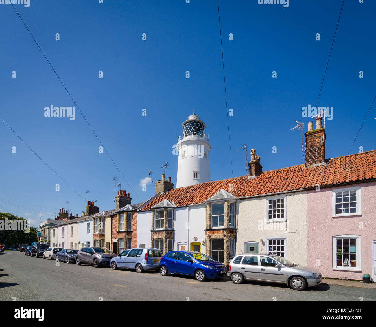 Lighthouse behind terraced houses in Southwold, Suffolk, England Stock Photo