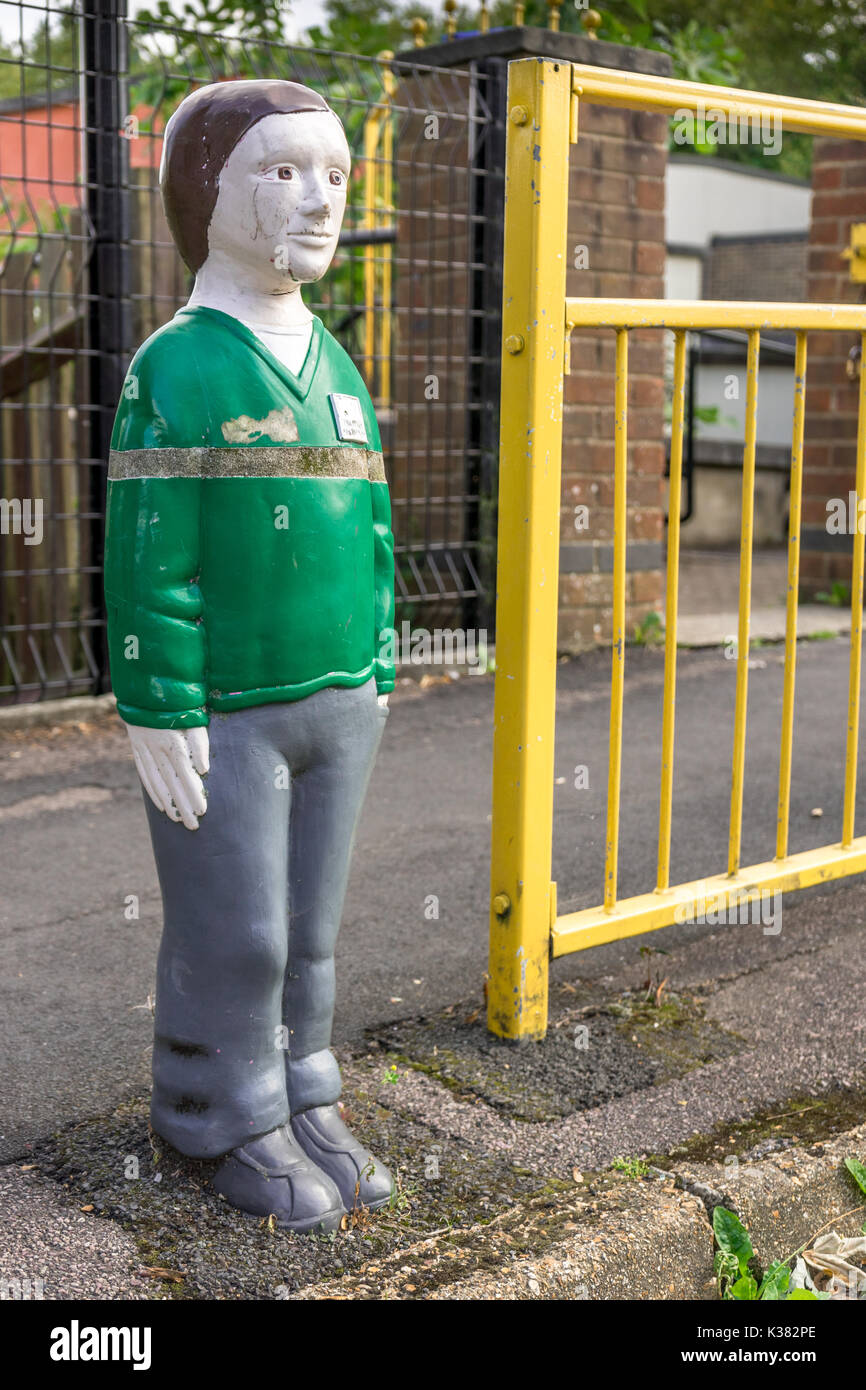 A figure of a school boy at the entrance to a Primary School in Hampshire Stock Photo