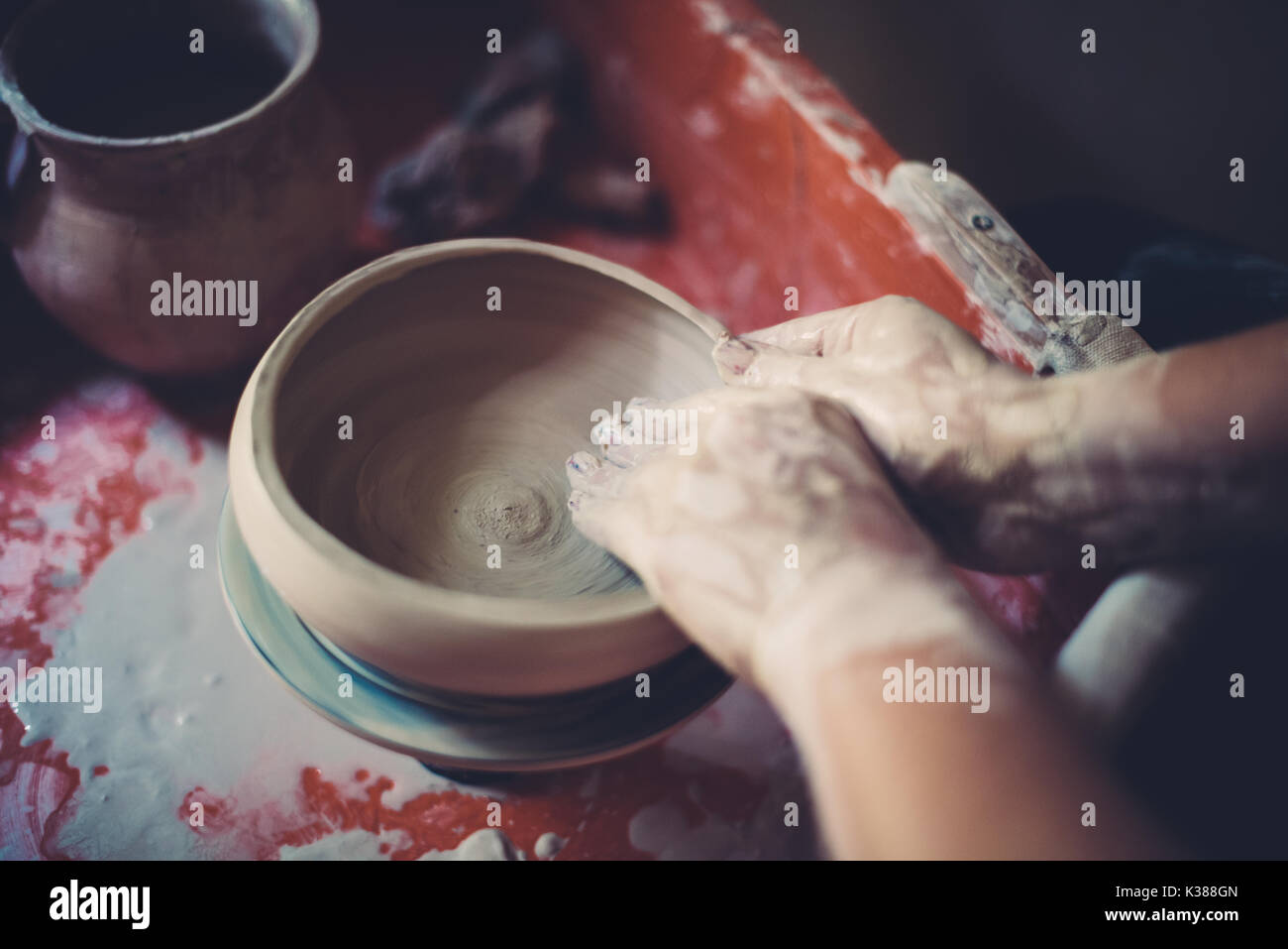 Work in a pottery workshop, womans hands creating ceramics Stock Photo ...