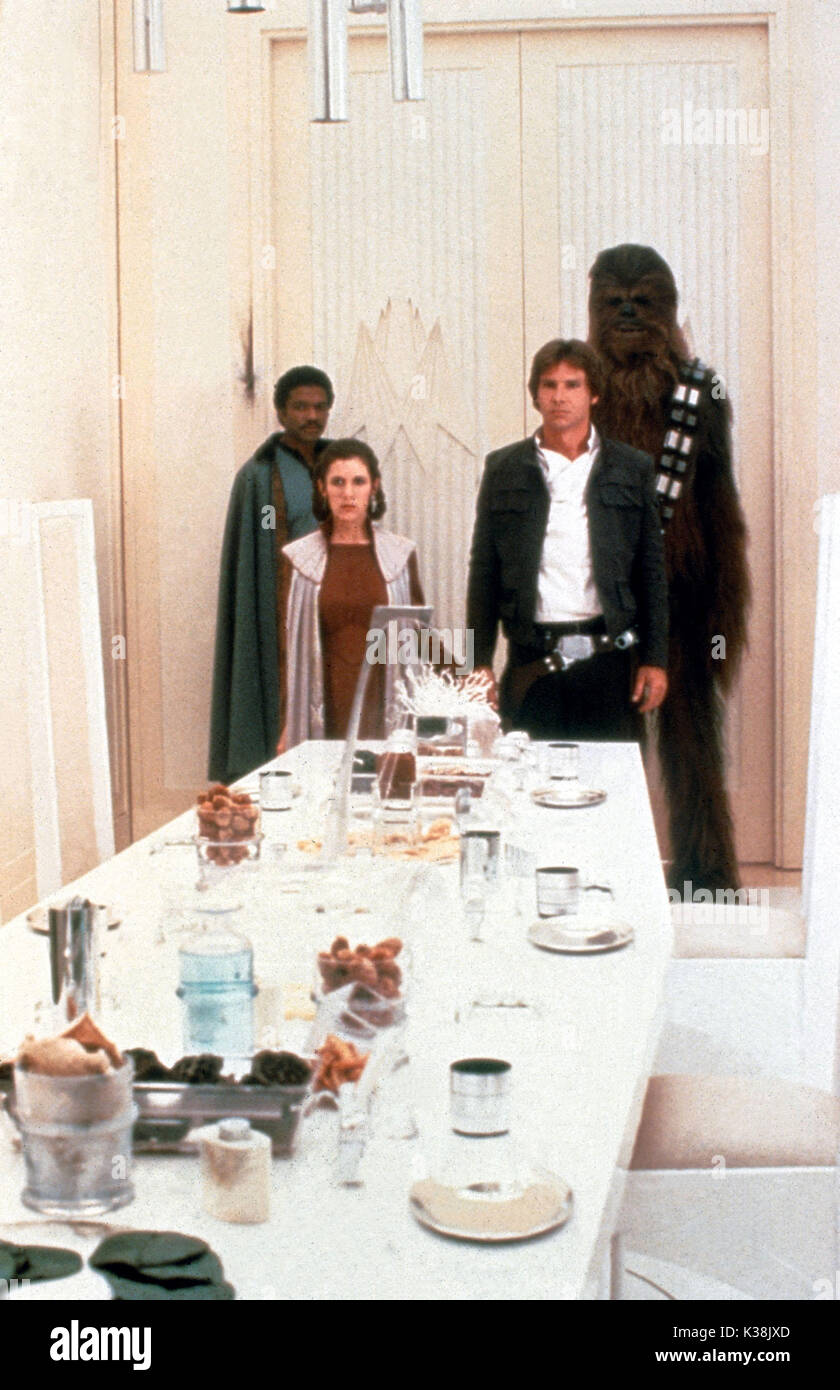 STAR WARS: EPISODE V - THE EMPIRE STRIKES BACK [US 1980]  BILLY DEE WILLIAMS as Lando Calrissian, CARRIE FISHER as Princess Leia, HARRISON FORD as Han Solo, 'Chewbacca' performed by PETER MAYHEW     Date: 1980 Stock Photo