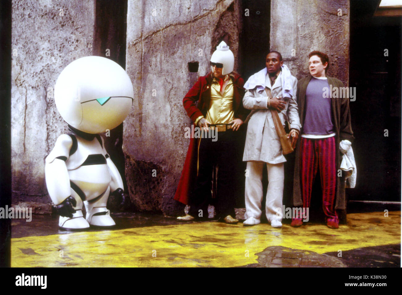 THE HITCHHIKER'S GUIDE TO THE GALAXY [ US / BR / 2005 ]   [robot] Marvin, as voiced by ALAN RICKMAN  SAM ROCKWELL, as Zaphod Beeblebrox,  MOS DEF, as Ford Prefect,  MARTIN FREEMAN, as Arthur Dent Stock Photo