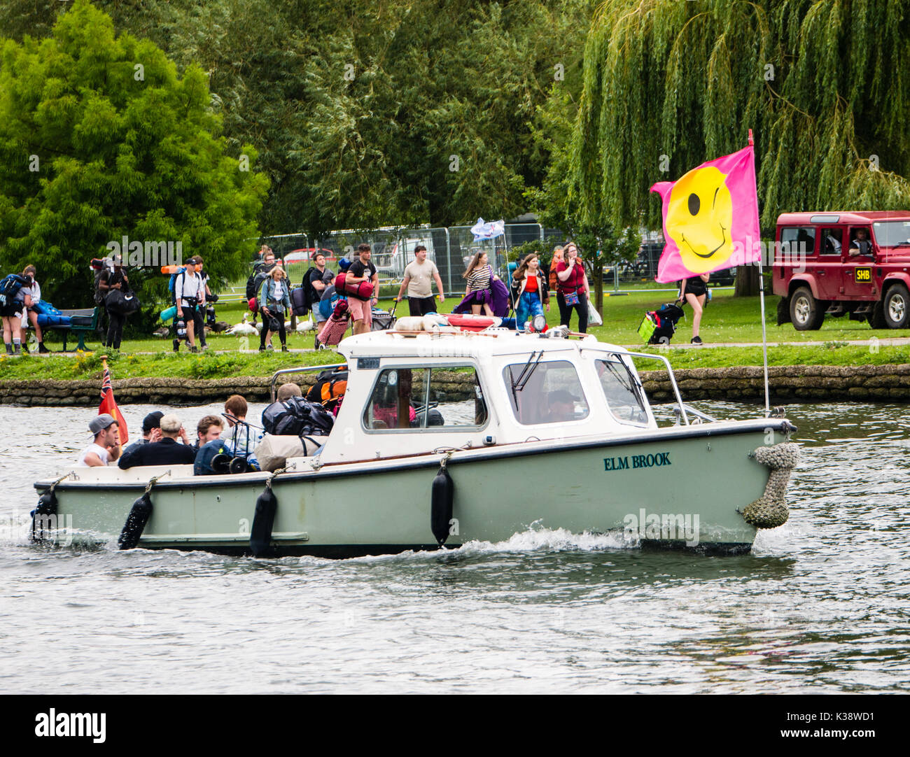 Audience on Way To Reading Festival, Banks of River Thames, Reading, Berkshire, England Stock Photo