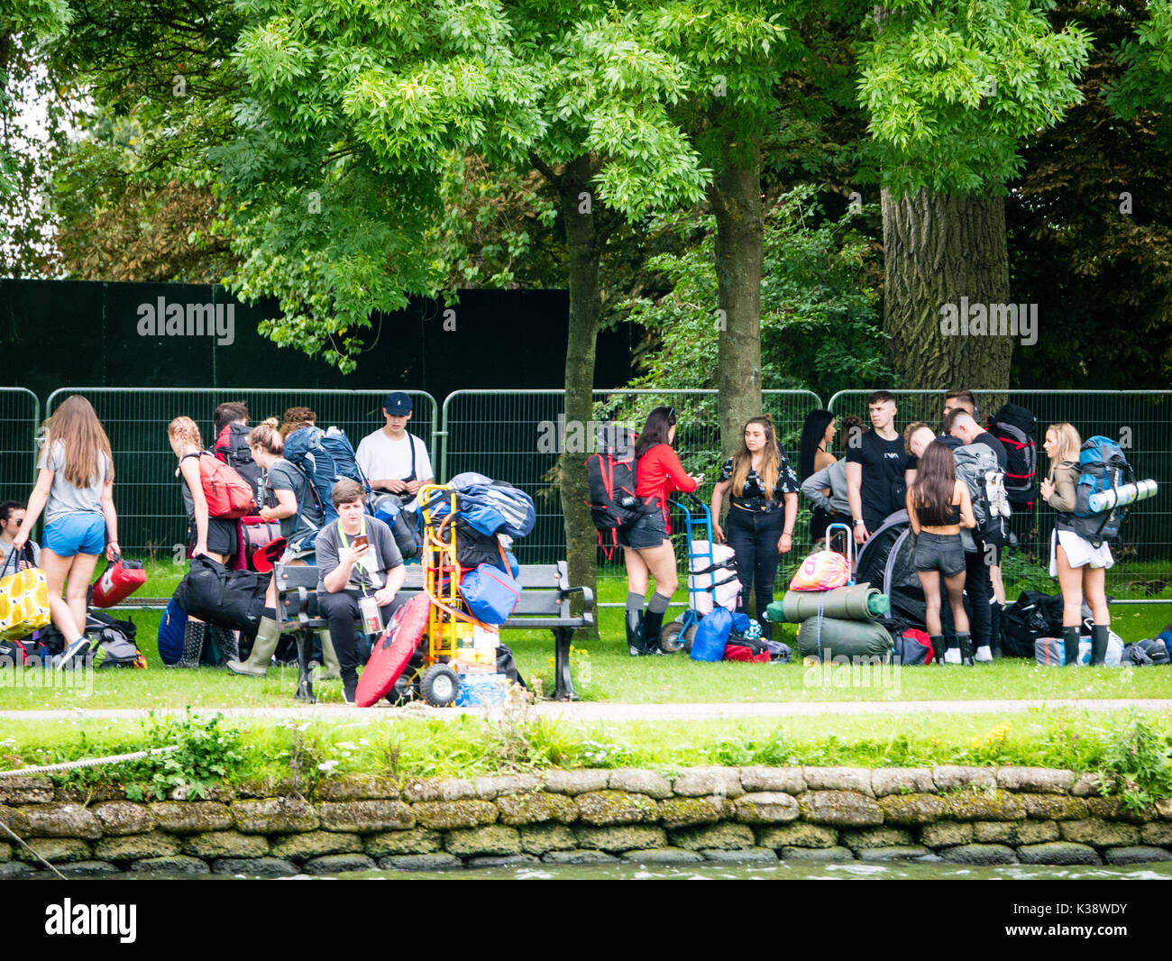 Audience on Way To Reading Festival, Banks of River Thames, Reading, Berkshire, England Stock Photo