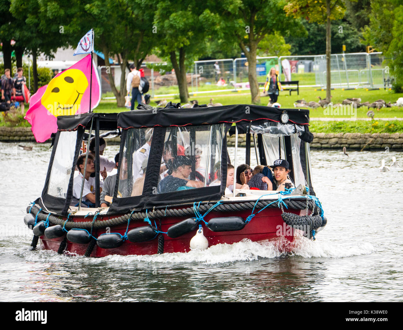 Audience on Way To Reading Festival, Banks of River Thames, Reading, Berkshire, England Stock Photo