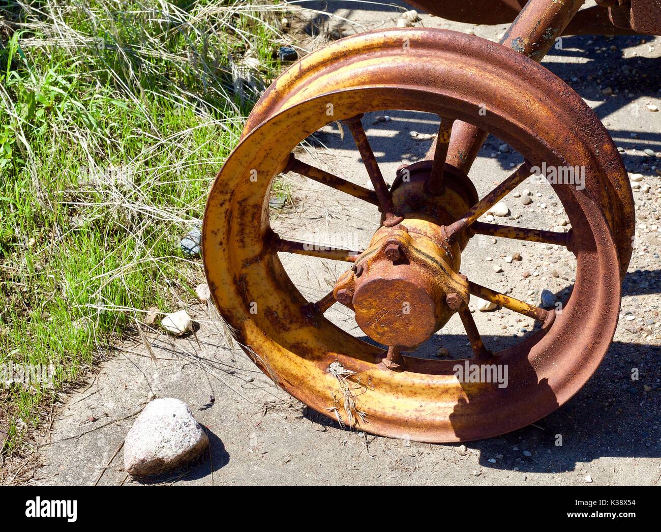 Old iron plow wheel in bright sun Stock Photo 156933424 Alamy