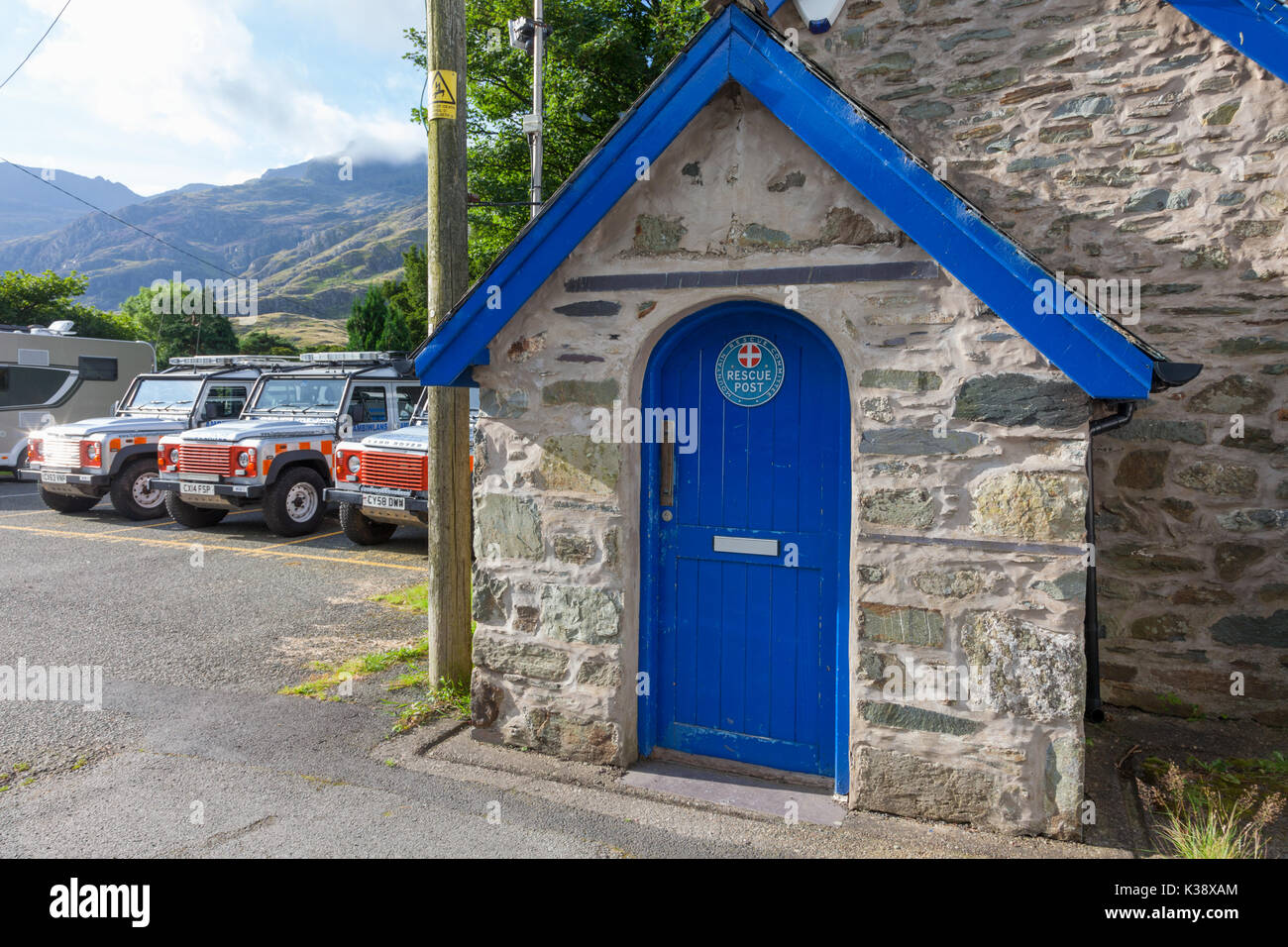 Front door and vehicles of the Llanberis Mountain Rescue Post, Wales UK Stock Photo