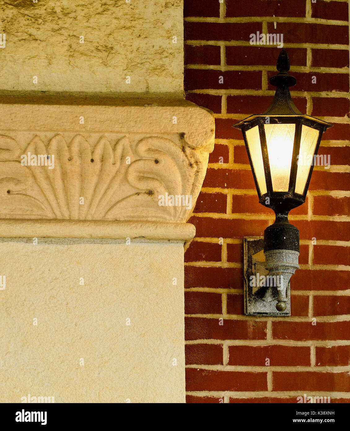 Nineteenth  century entrance pillar with lamp at side Stock Photo