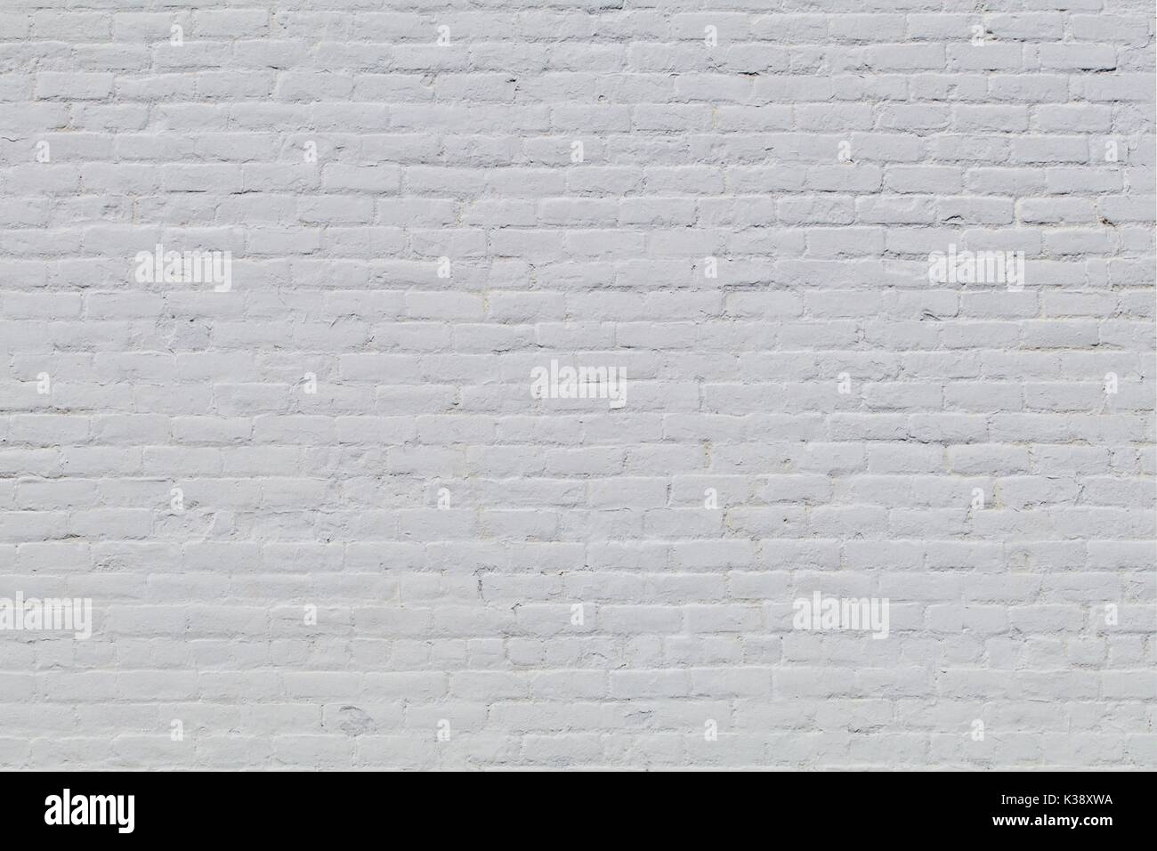 Solid old brick wall with white paint Stock Photo