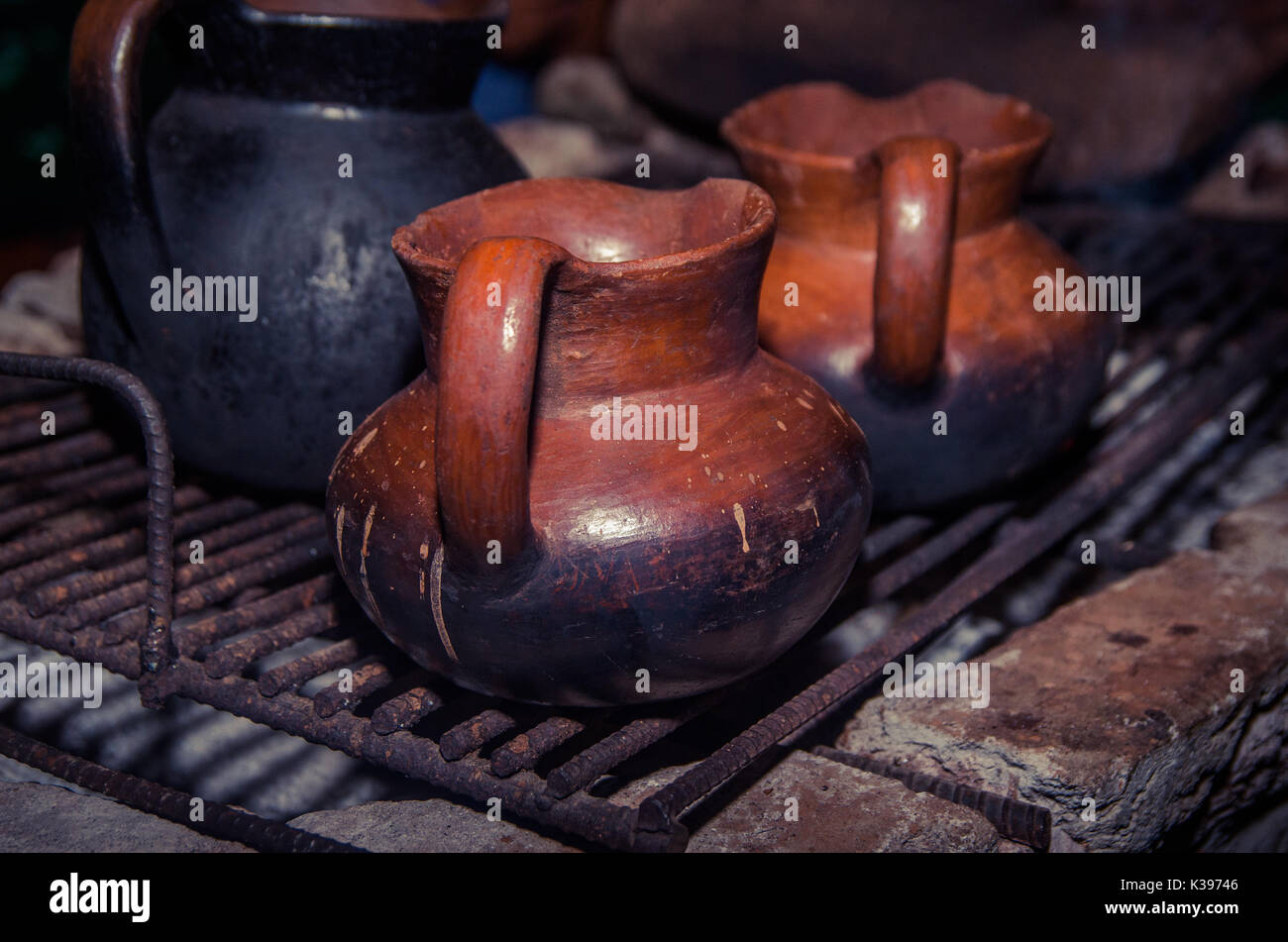 https://c8.alamy.com/comp/K39746/close-up-of-a-jar-of-clay-over-a-wood-stove-boiling-water-to-mix-with-K39746.jpg