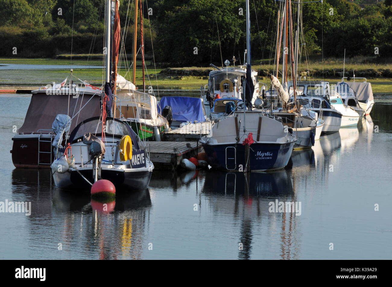 yachts and dinghies moored in the quiet waters of newtown creek