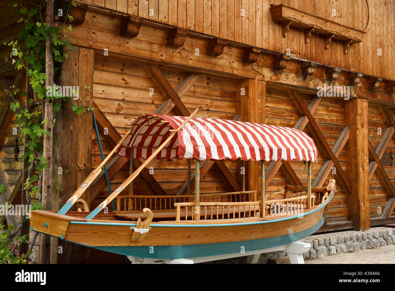 Newly hand crafted traditional wood Pletna boat outside woodworking shop in Mlino village for unique use on Lake Bled Slovenia Stock Photo