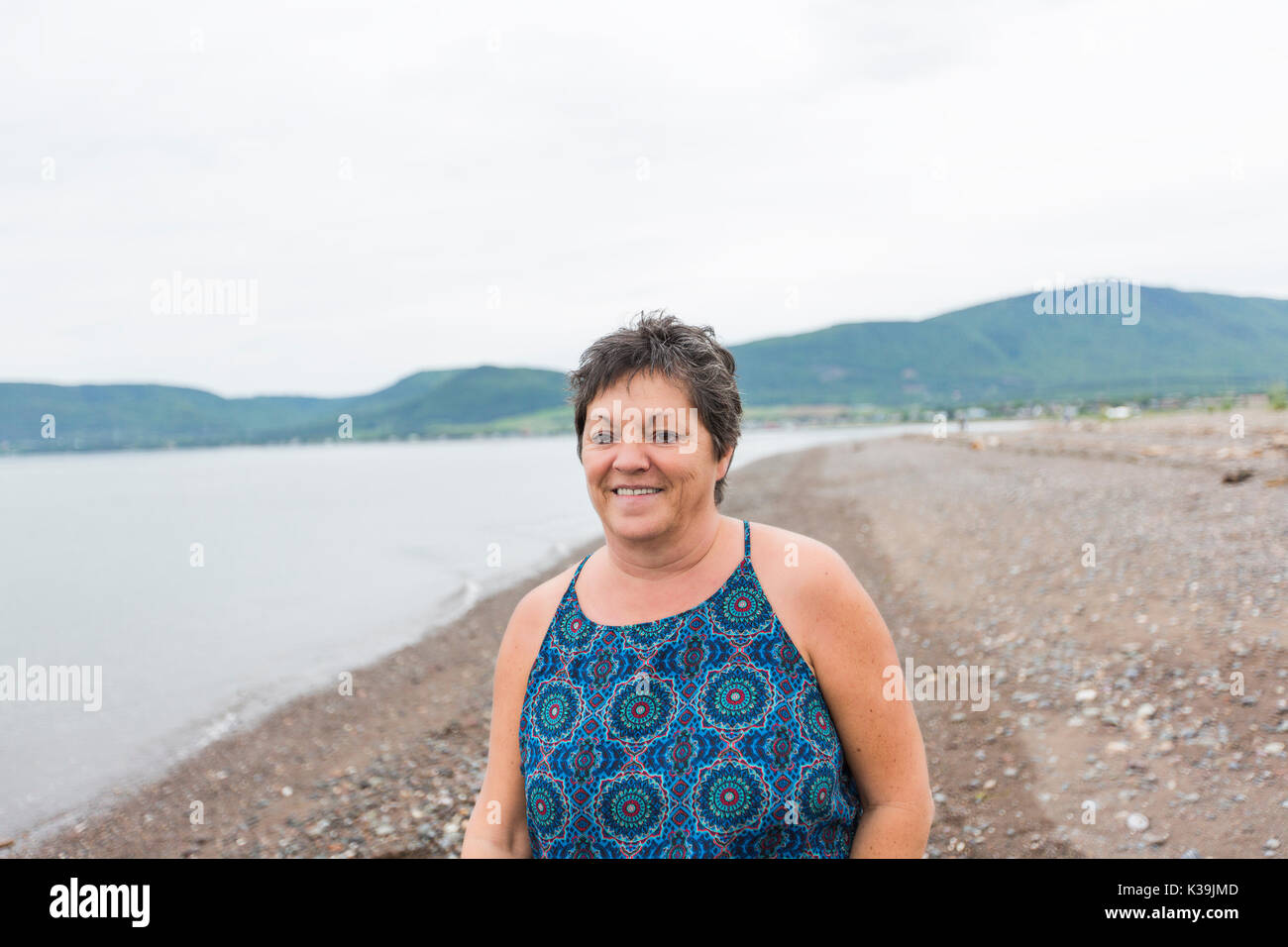 Middle aged woman portrait on the beach Stock Photo