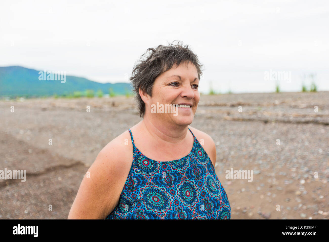 Middle aged woman portrait on the beach Stock Photo