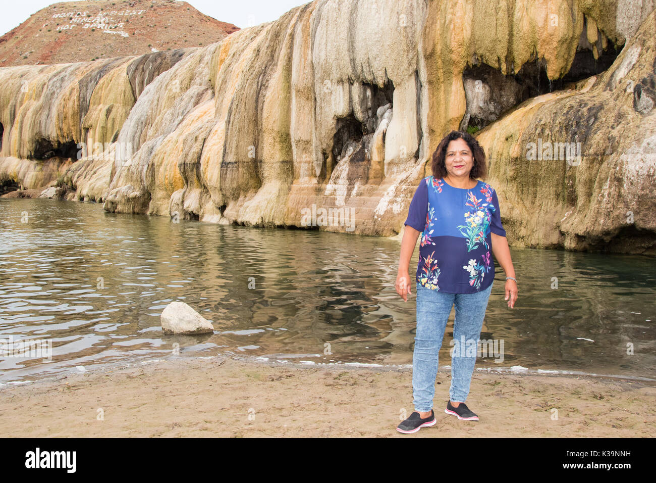 Asian woman posing by a gethermal terrace in Hot Springs State Park, Thermopolis, WY Stock Photo