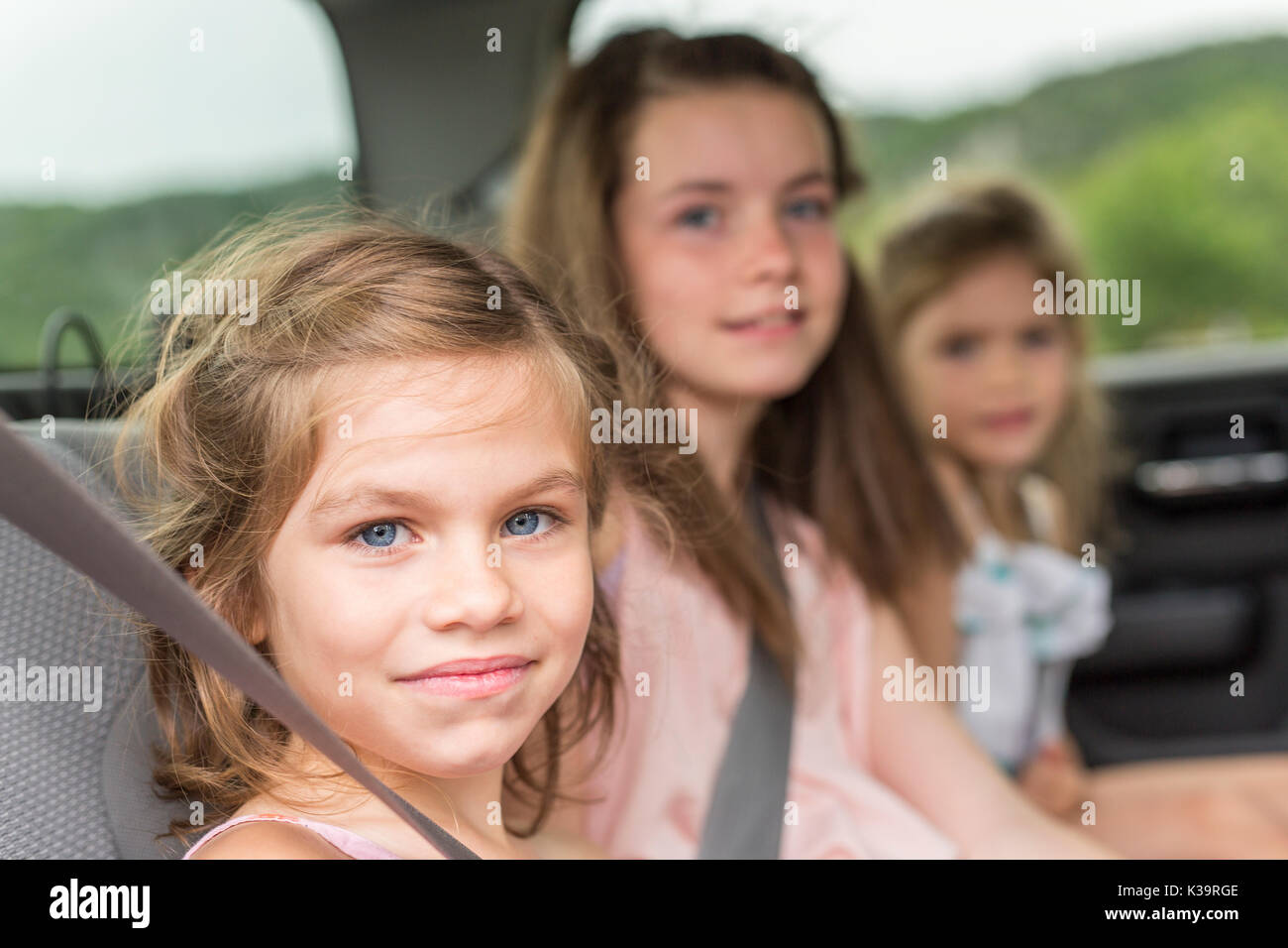 little girls inside car Stock Photo