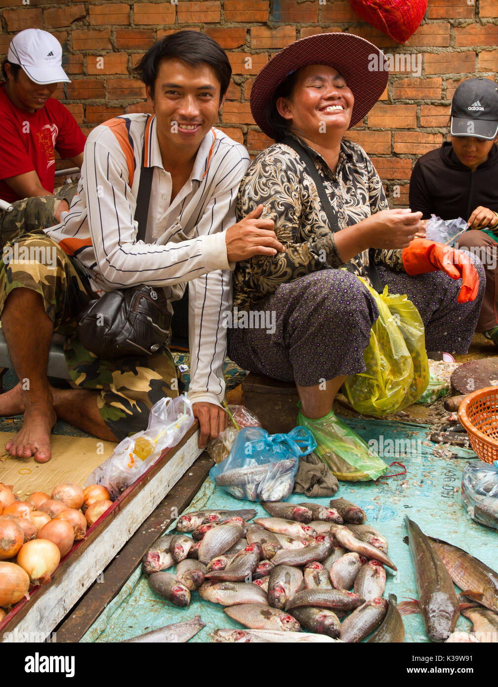 Friendly vendors share a laugh at a market in Cambodia on Oct 15, 2011 Stock Photo