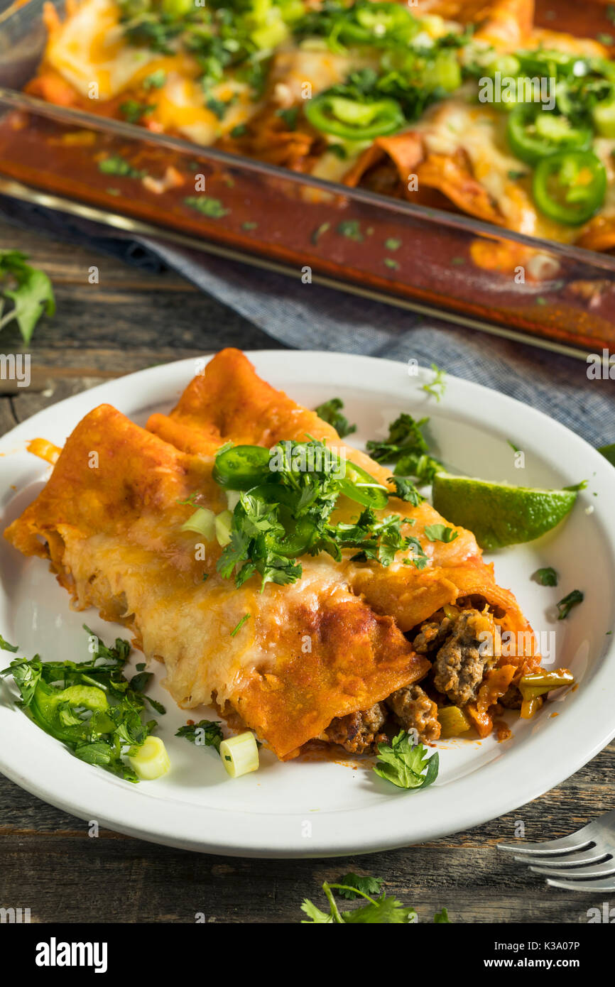 Homemade Beef Enchiladas with Red Sauce and Cilantro Stock Photo Alamy