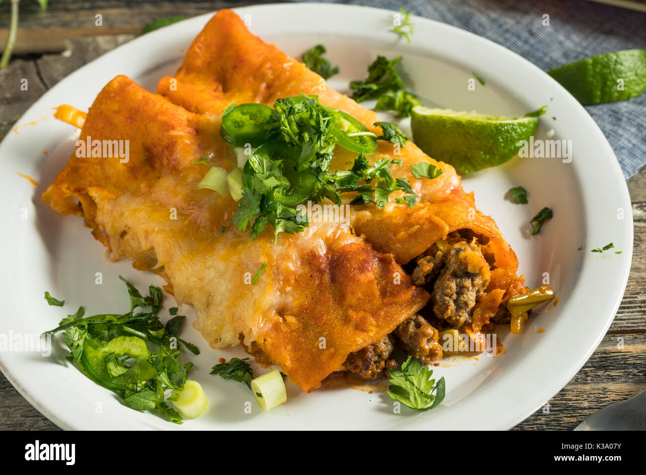 Homemade Beef Enchiladas with Red Sauce and Cilantro Stock Photo Alamy