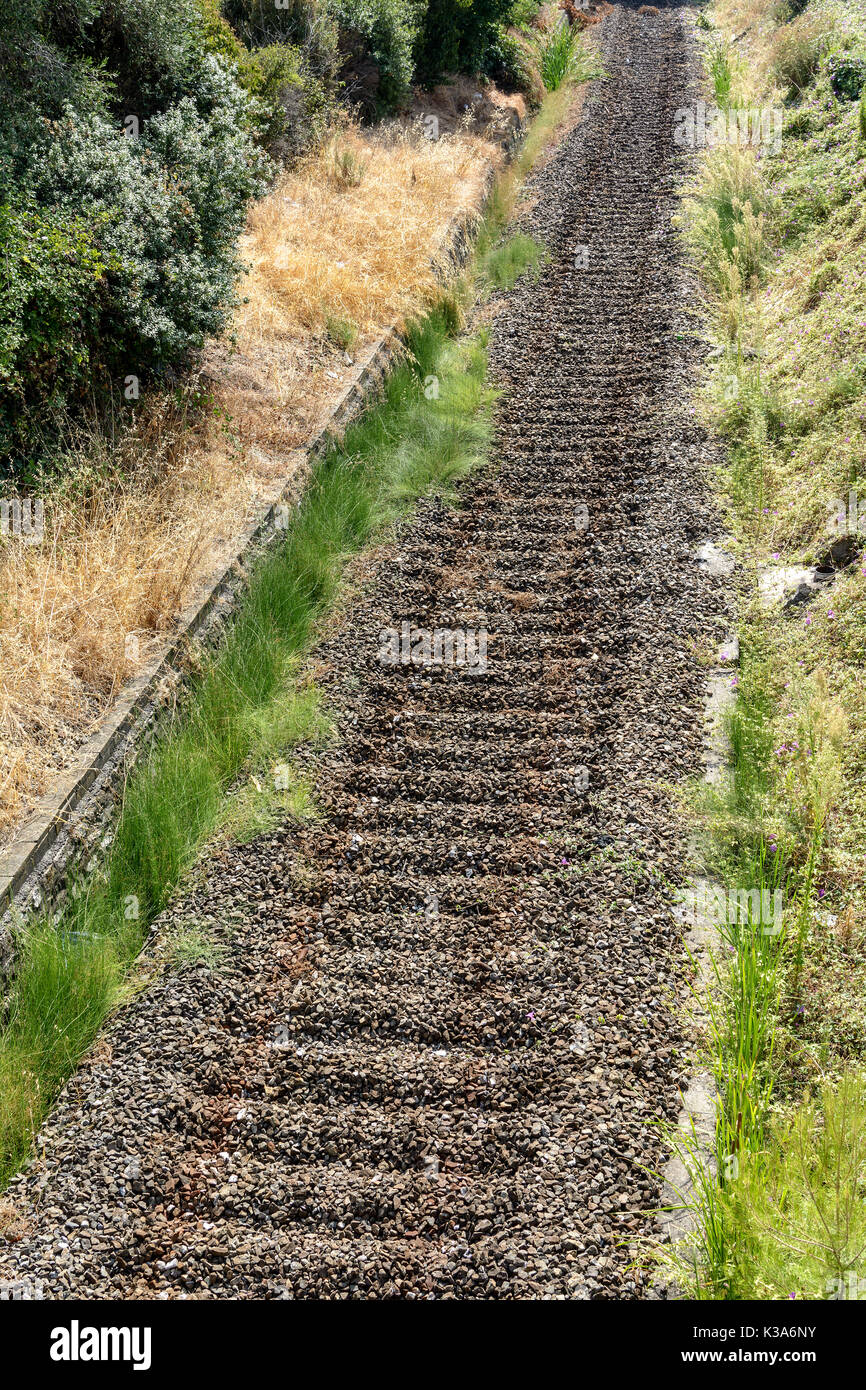 railway with massive rocks of train rails without tracks Stock Photo