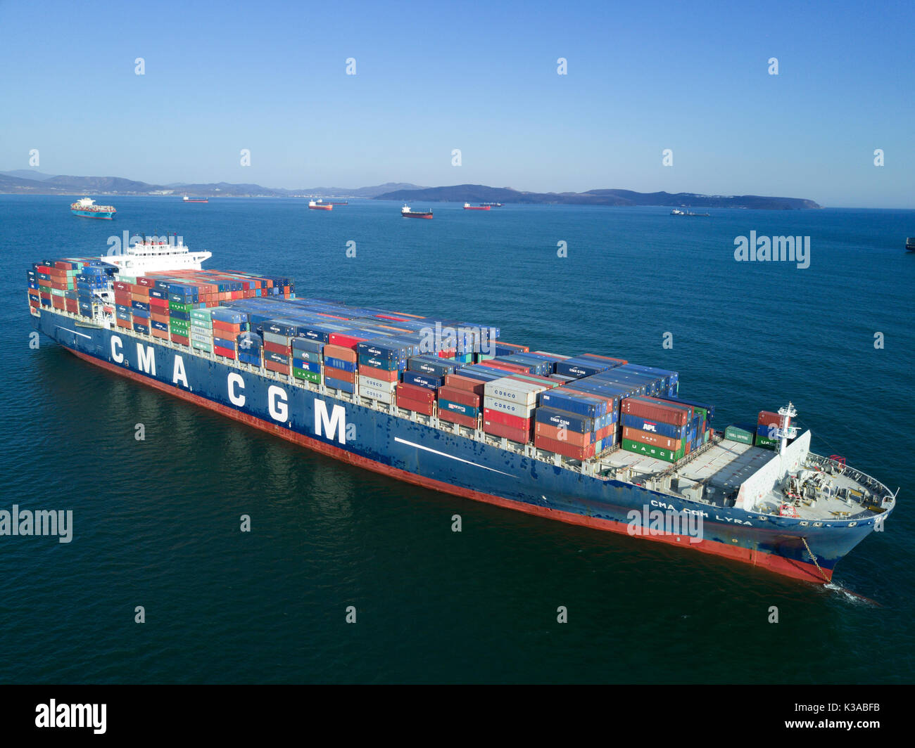 Nakhodka, Russia- April 25, 2017: Container ship CMA CGM Lyra standing on the roads at anchor. Stock Photo