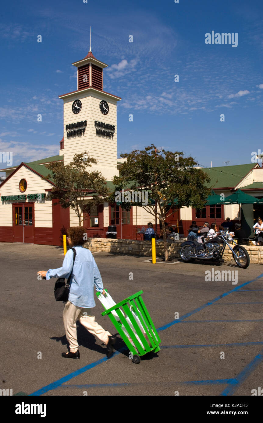 Iconic green shopping carts in use at the venerable Farmer's Market in