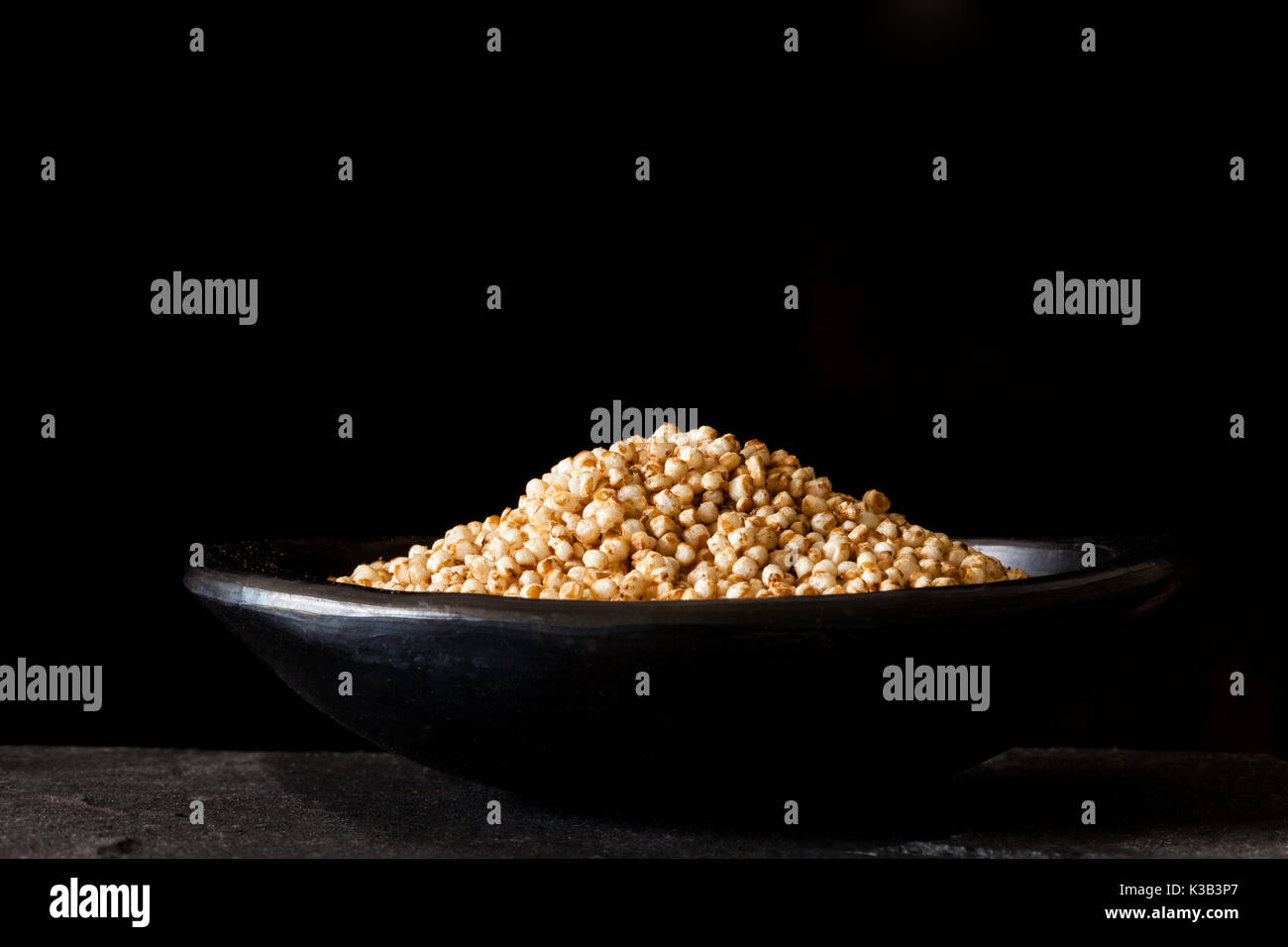 Puffed quinoa seeds (Chenopodium quinoa) in a traditional black clay dish Stock Photo Alamy