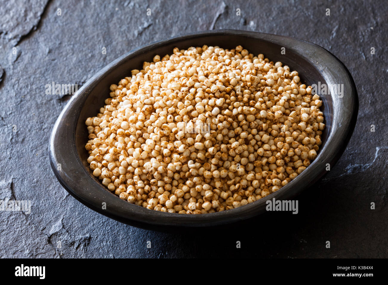 Puffed quinoa seeds (Chenopodium quinoa) in a traditional black clay dish Stock Photo Alamy