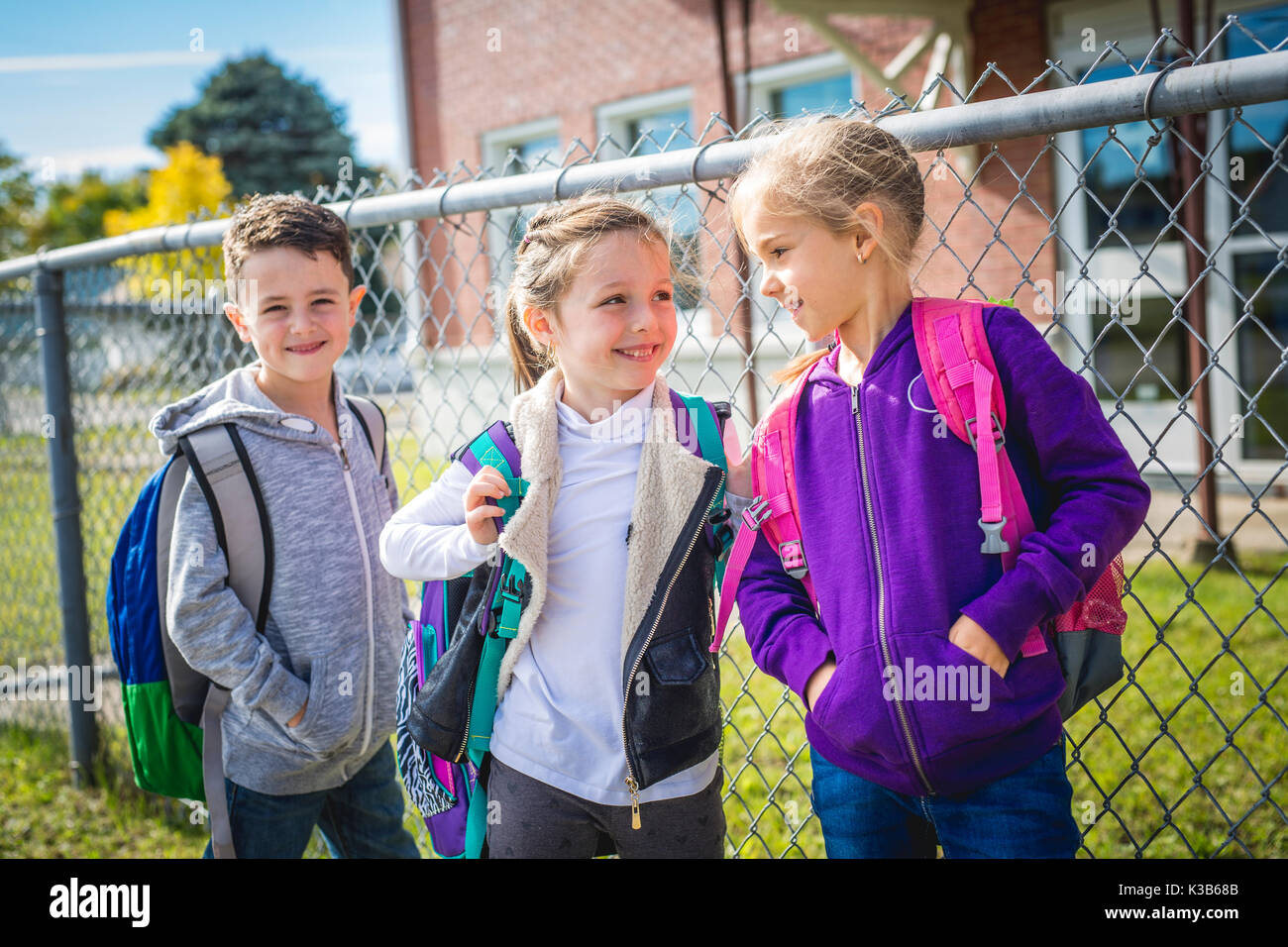 students outside school standing together Stock Photo - Alamy