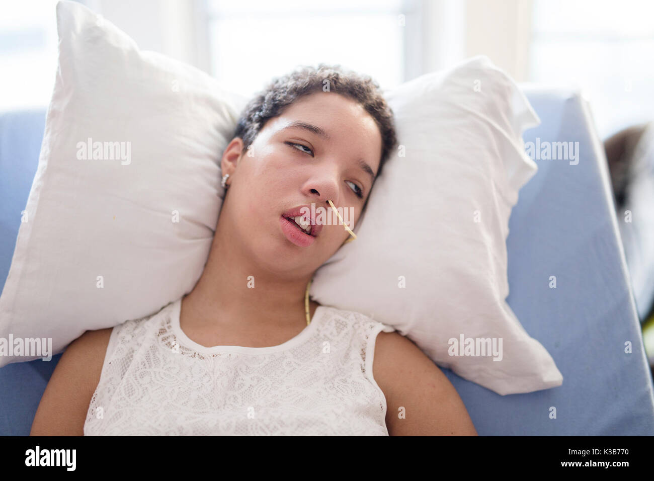 Sick patient lying on bed in hospital for medical background Stock Photo