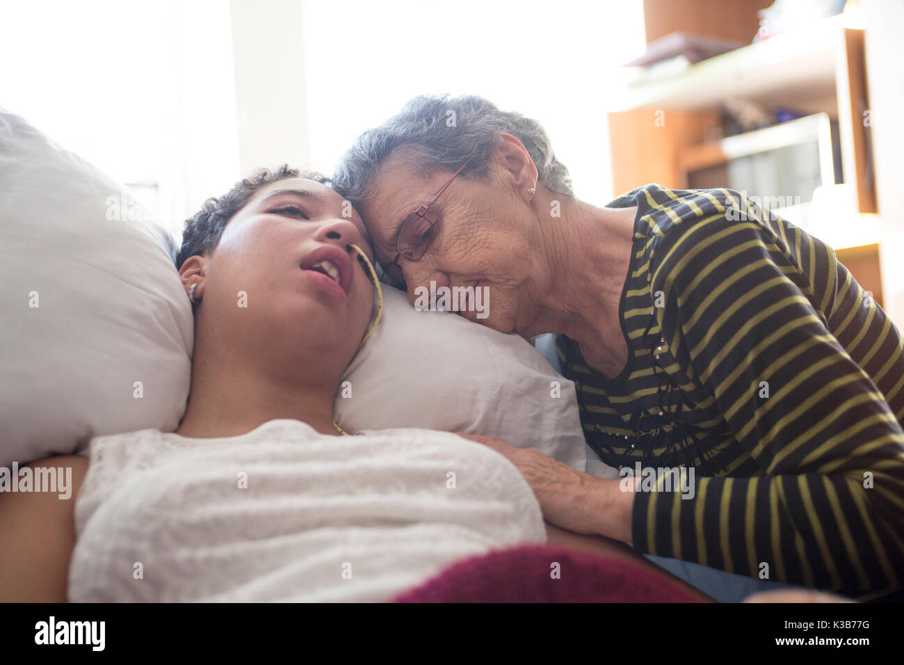 Sick patient lying on bed in hospital for medical background Stock Photo