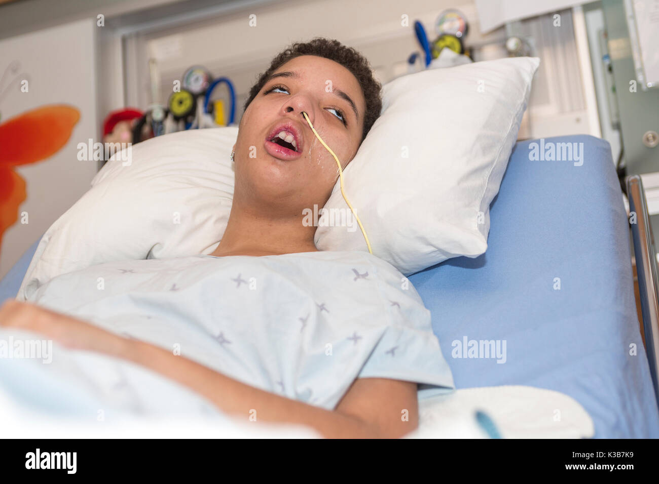 Sick patient lying on bed in hospital for medical background Stock Photo -  Alamy