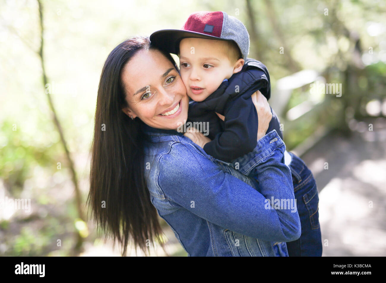 Mother and son in forest having fun Stock Photo