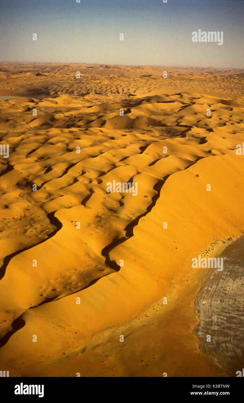 Aerial view of the massive red dunes and sabkha flats near the Shaybah ...