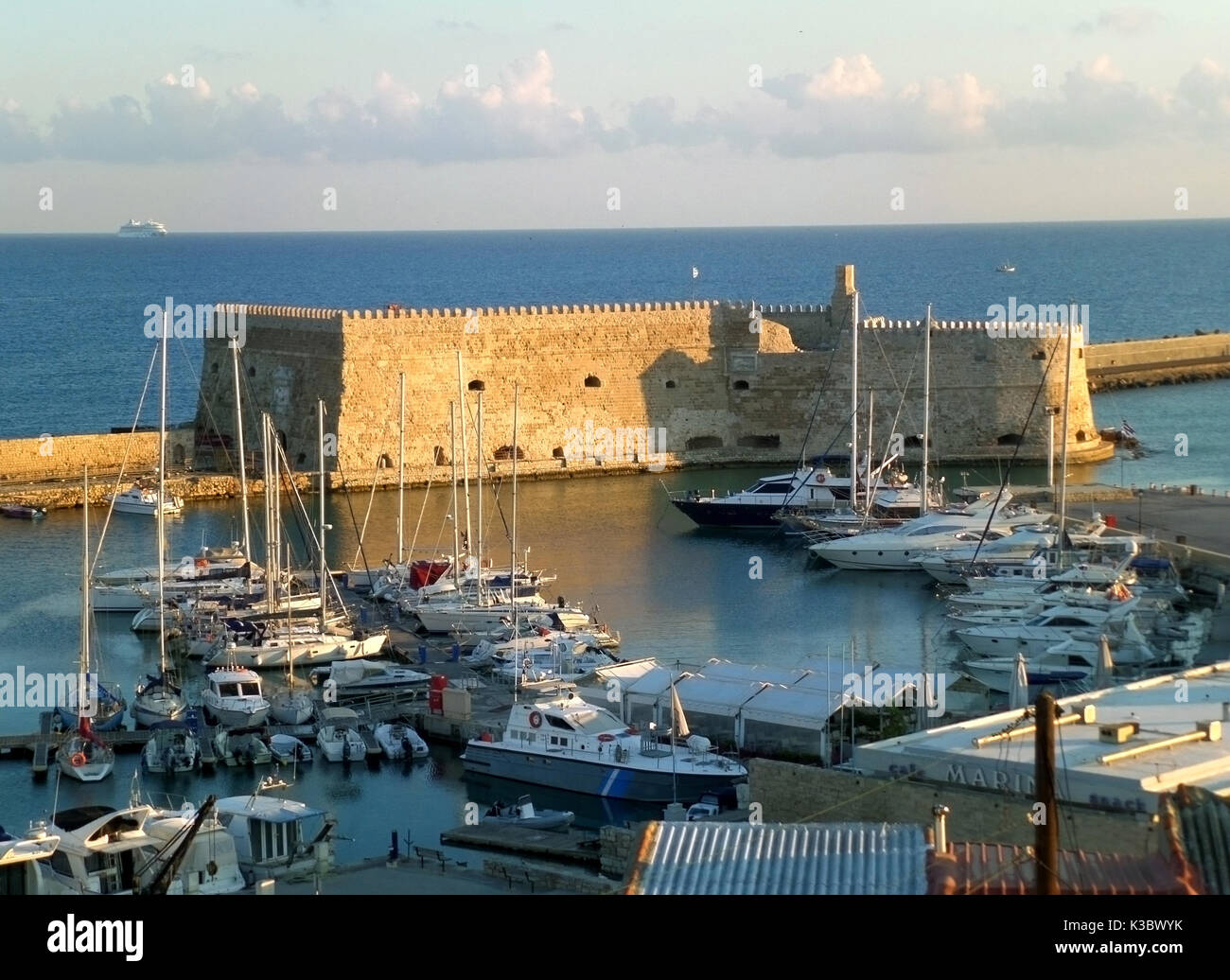 The Historic Venetian Fortress Castello a Mare in the Morning Sunlight, Old Port of Heracleion, Crete Island of Greece Stock Photo