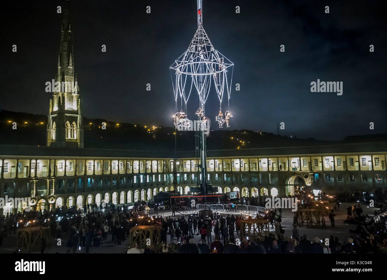 Performers during The Enchanted Chandelier, an international award-winning aerial show, at the Grade I listed Piece Hall in Halifax. Stock Photo
