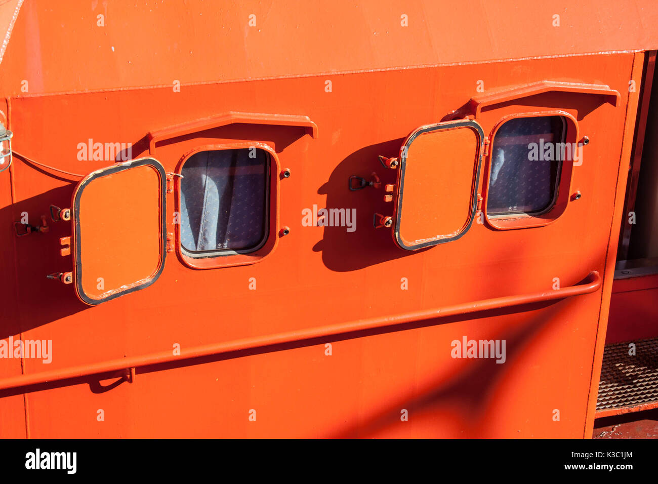 Red tugboat close up windows detail Stock Photo
