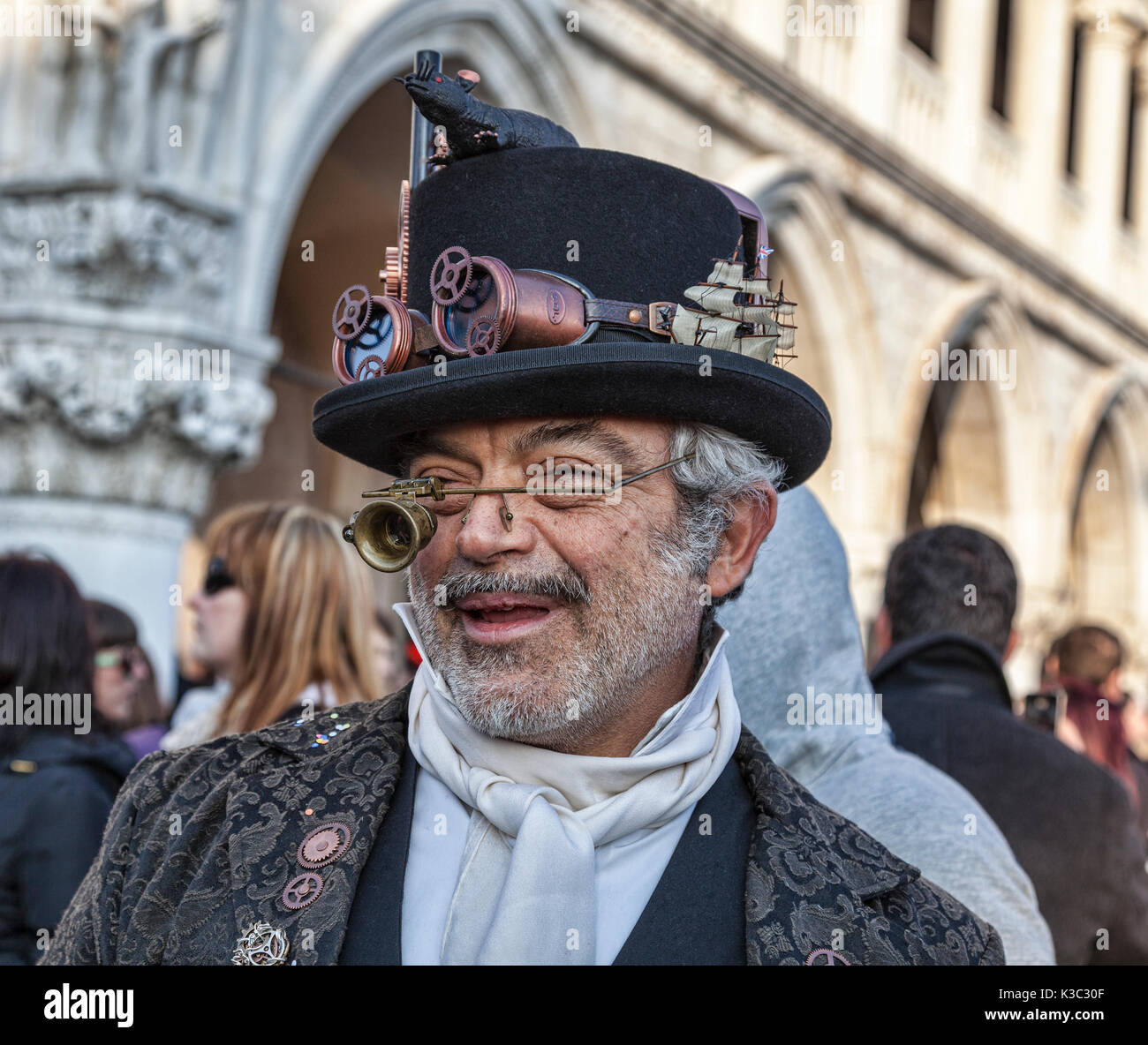 Venice, Italy- February 18th, 2012: Environmental portrait of aa eccentric man funny disguised during the Venice Carnival days. Stock Photo