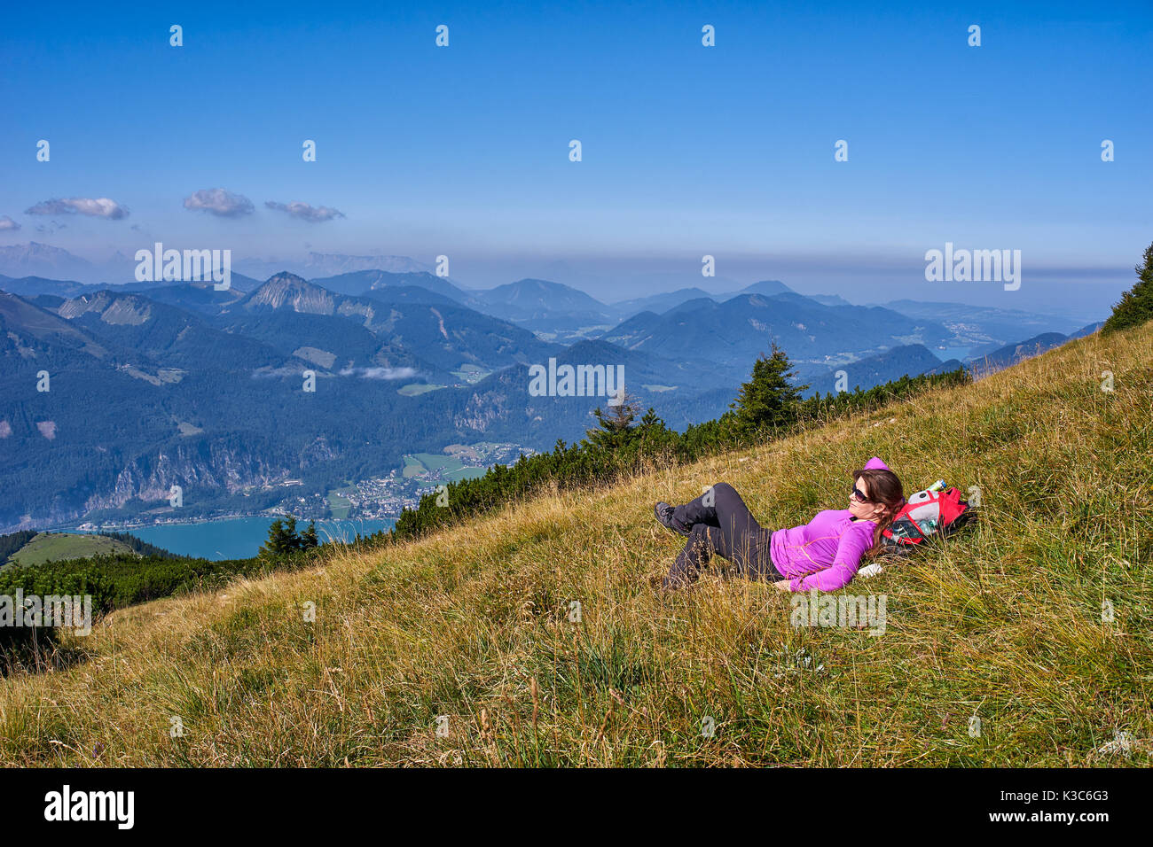 Woman with backpack in mountains Stock Photo