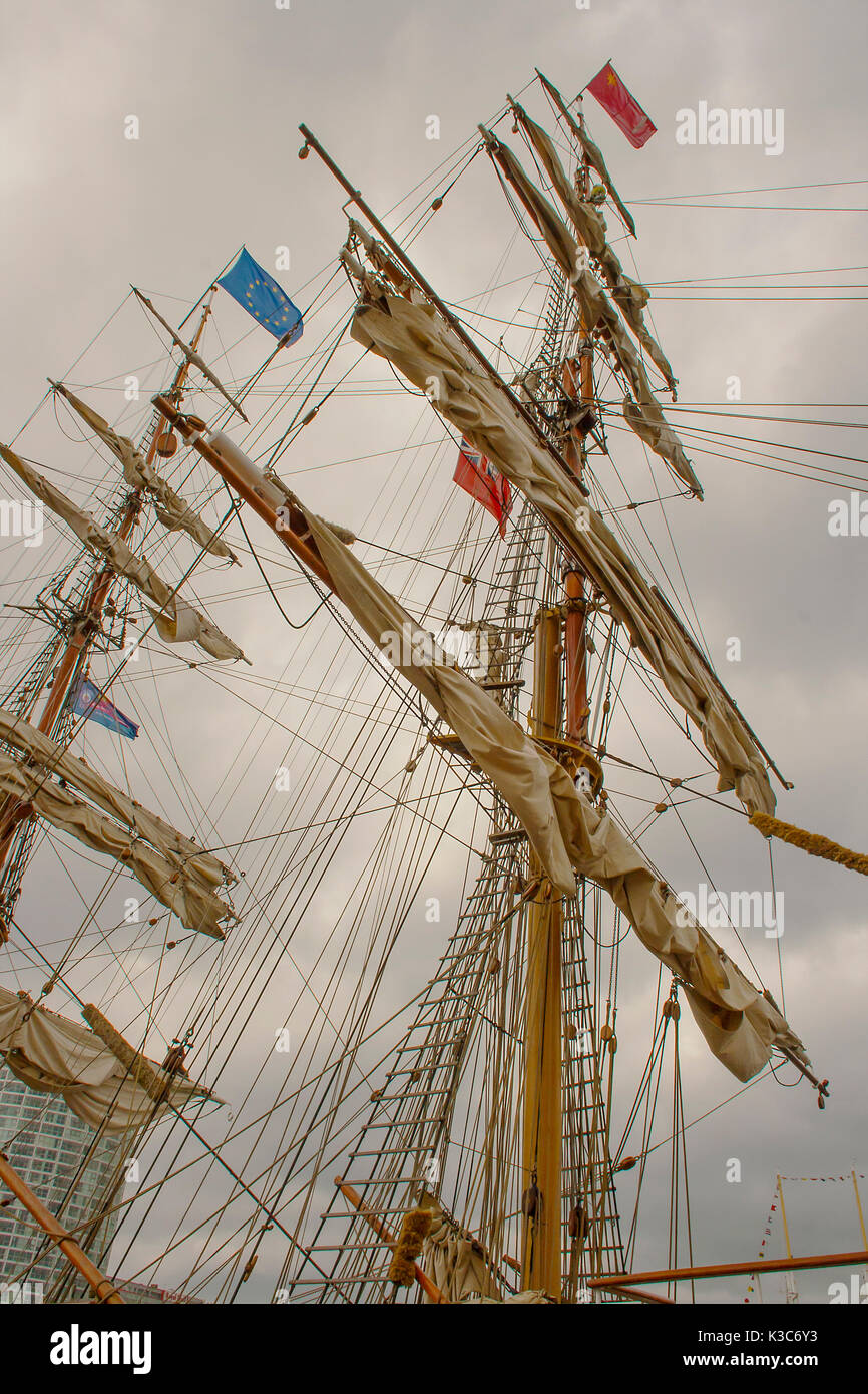 Typical Masts and rigging with ropes and cables of a tall ship sailing boat while on a visit to Belfast, Northern Ireland in 2015 Stock Photo