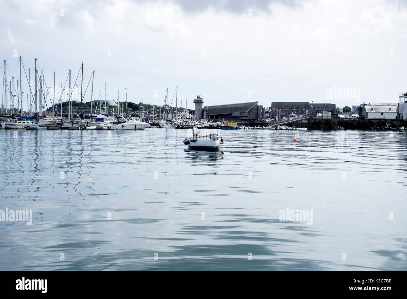 View of Falmouth Haven, a deep water mooring and leisure boat marina, on a clear and calm weather day. Stock Photo