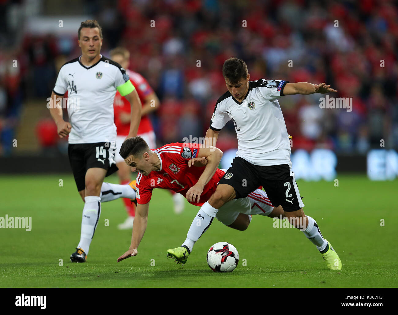 Wales' Tom Lawrence (cente) in action with Austria's Stefan Lainer during the 2018 FIFA World Cup Qualifying, Group D match at the Cardiff City Stadium. Stock Photo