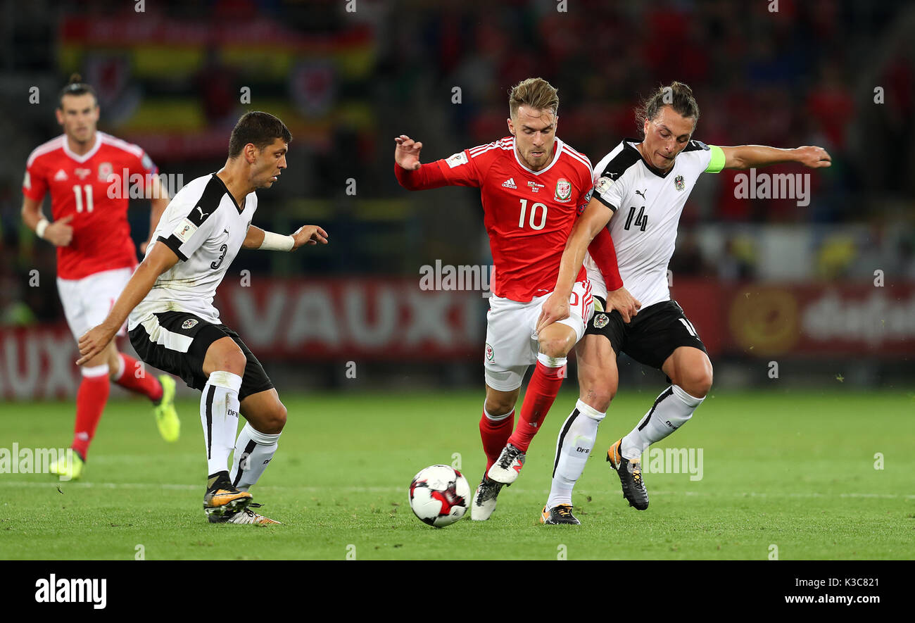 Wales' Aaron Ramsey (centre) in action with Austria's Aleksander Dragovic (left) and Julian Baumgartlinger during the 2018 FIFA World Cup Qualifying, Group D match at the Cardiff City Stadium. Stock Photo