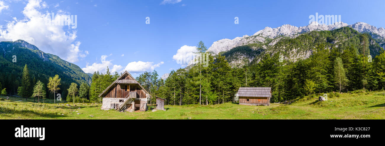 Mountain cabin, hut in European Alps, located in Robanov kot, Slovenia, popular hiking and climbing place with picturescue view, XXXL Large Panorama Stock Photo