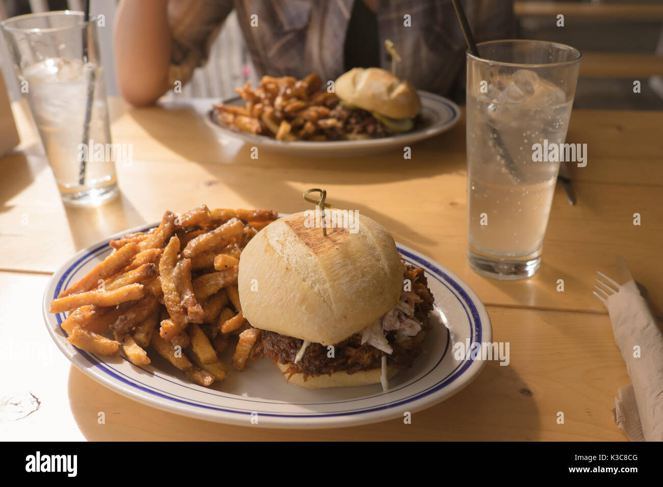 Pulled pork Barbecue Sandwich with garlic fries at Meat Restaurant in