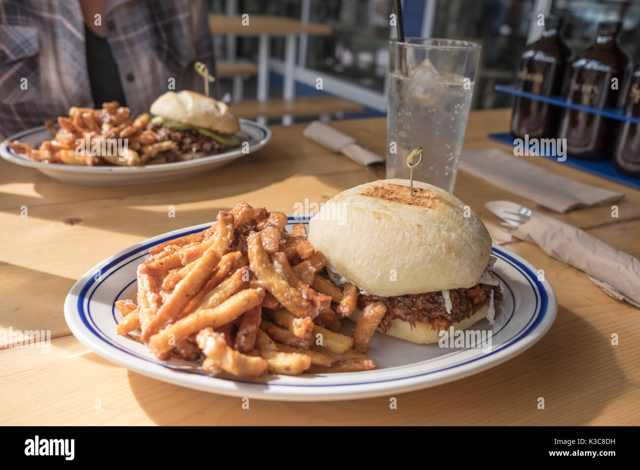 Pulled pork Barbecue Sandwich with garlic fries at Meat Restaurant in Strathcona, Edmonton